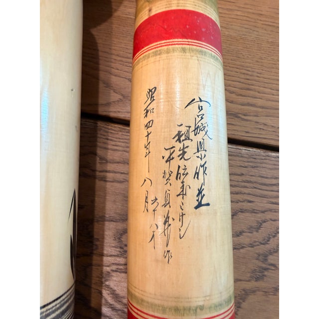 Beautiful curated collection of vintage Japanese Kokeshi folk art dolls, featuring hand-painted details, rich natural wood...