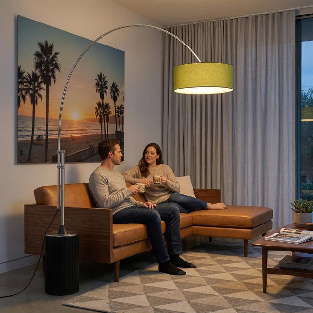 The Tambo Arc Lamp is a Mid-Century Modern floor lamp designed by Peter Morelli in 1984, featuring a satin nickel finish...