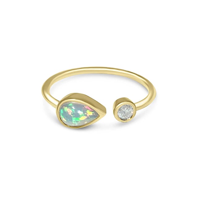 This is part of Chairish’s Fine Jewelry assortment. Shop our 14K gold, teardrop-shaped opal and bezel-set diamond ring!...
