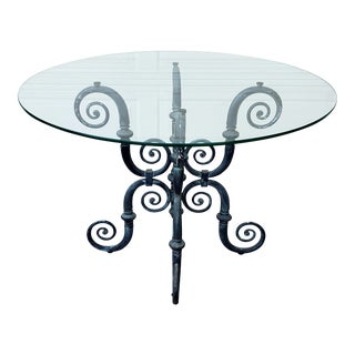 1920s French Renaissance Sculptured Iron Base Dining Table With Round Glass Top For Sale