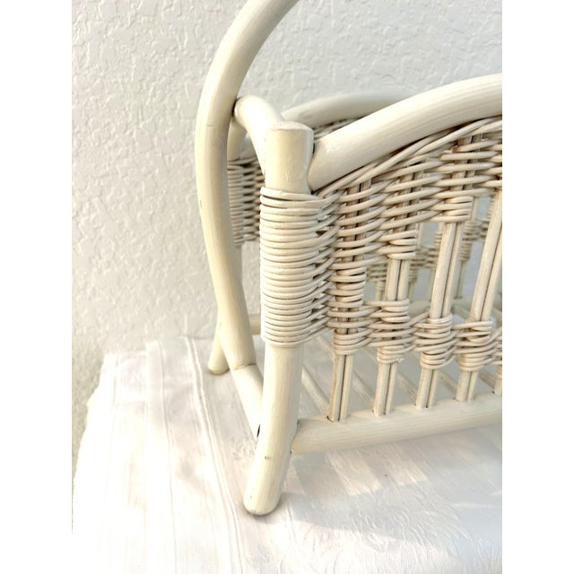 Stylish mid-century bamboo, rattan and wicker handled magazine rack in off-white. Piece is well constructed.