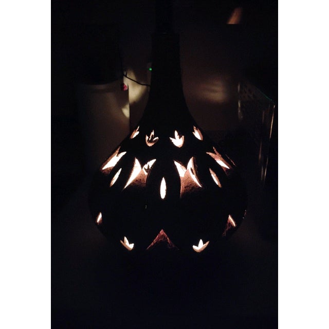 Vintage Mid Century Modern XL lamp features a unique cut-out design in gold and brown, with a white light color and an...