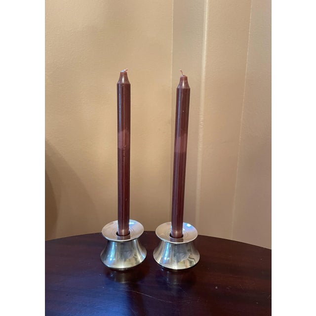 It is difficult to capture in pictures the simple, graceful beauty of this pair of sterling candleholders by Gorham....