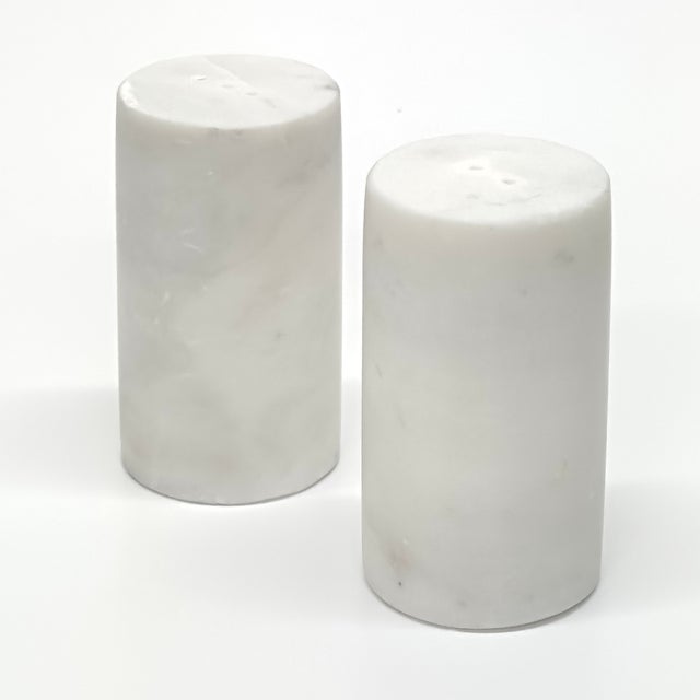 White salt & pepper shakers, group of 2. This is a minimal set of stone cylindrical shakers in a white and gray colorway....