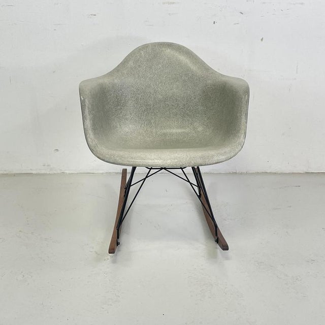 Original Charles and Ray Eames rocking chair in Seafoam. Vintage fibreglass shell on replacement black owder coated base...