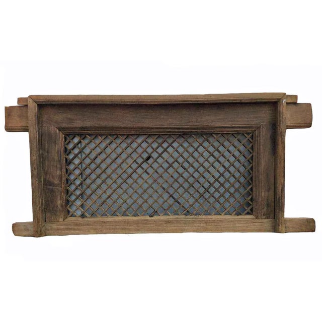 Made of elm, this wood screen window is over 150 years old. It is in its original wood color and with frame. An intriguing...