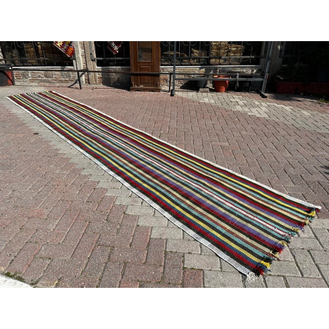 This beautiful, vintage, handwoven kilim is approximately 60 years old. It is handmade of very fine quality wool and...