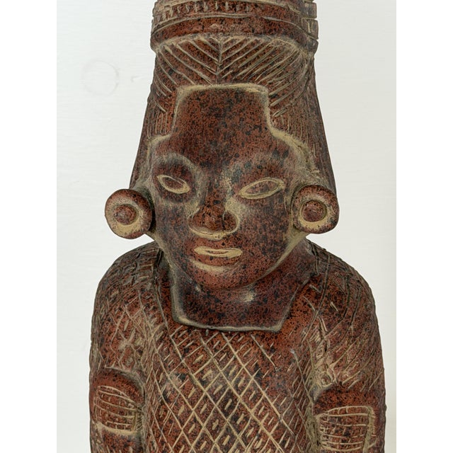 This terracotta figure is a mid-20th century Mexican folk art piece, made in the pre-Columbian revival style associated...