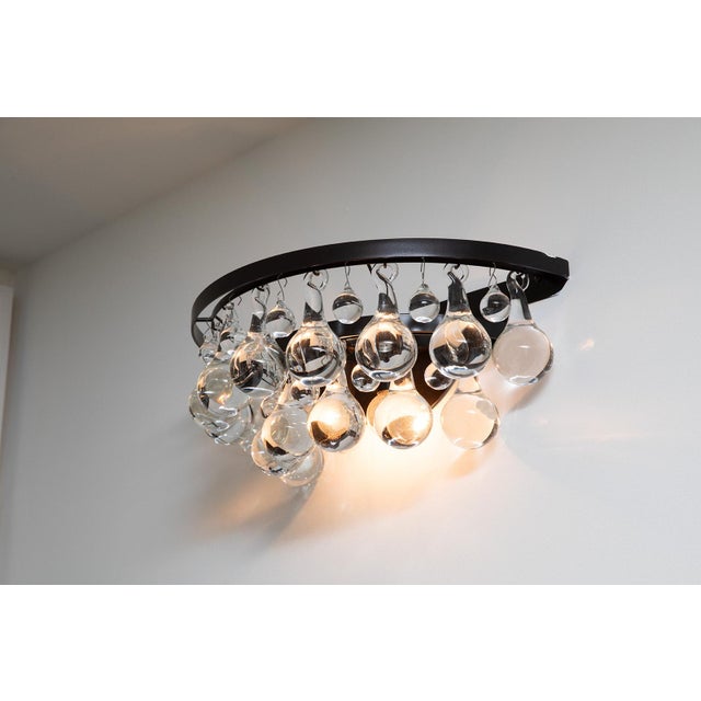 The Ochre Pear Sconce is a sculptural wall light that blends elegance with craftsmanship. It features two gently curved...