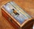 Decorate a shelf, desk, or tabletop with this charming set of four decorative wooden treasure boxes. Crafted in the late...