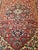 6’ 3”x 10’ 2” A vintage room size Persian Heriz from the 1st quarter of the 1900s. It has a burgundy color field and a...