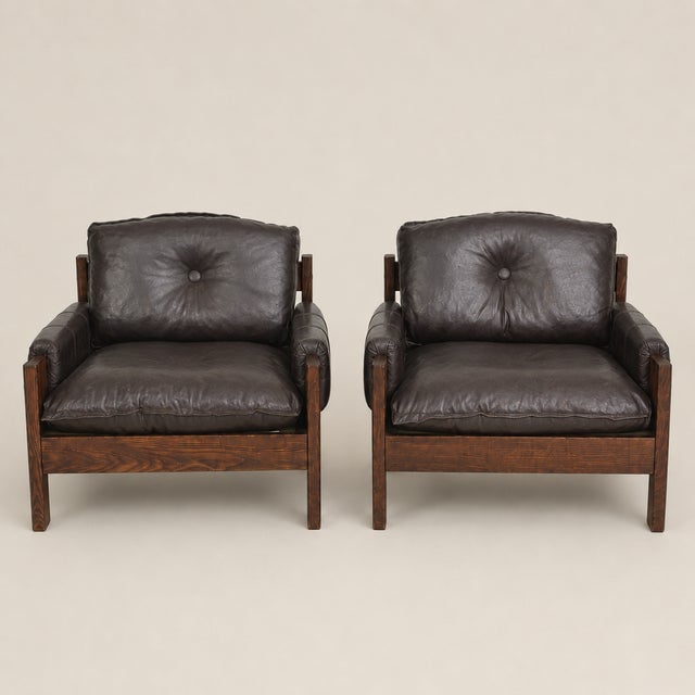 A handsome Danish Modern living room suite comprising a three-seat sofa and matching pair of lounge chairs, crafted in...