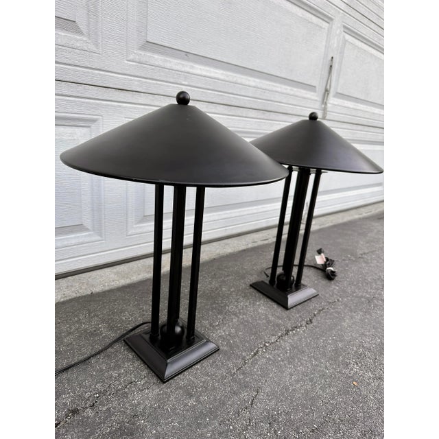 Amazing postmodern style table lamps. They come with metal cone shaped shades and the base has a 4 post design and an...