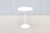 Fabulous 16" round white laminate top side table designed by Eero Saarinen for Knoll. It was introduced in 1956 and...