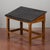 This vintage student desk captures the essence of mid-20th-century school furniture. Crafted from solid wood, the piece...
