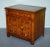A refined Baker Furniture bedside cabinet, rendered in beautifully figured walnut and elegant architectural doors. This...