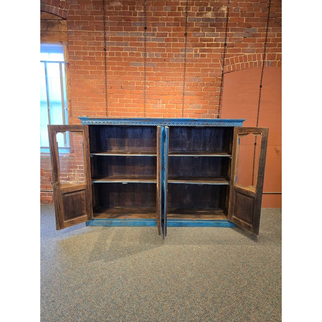 Add a bold pop of character to your space with this stunning, oversized rustic sideboard. Featuring a distressed vibrant...