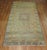 Antique Khotan rug with soft green field. Measures: 5'2" x 10'8" Khotan rugs were produced in Eastern Turkestan. Khotan...