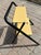 This a MCM folding metal step stool. It is probably made of steel, due its weight and it does react positively to a magnet...