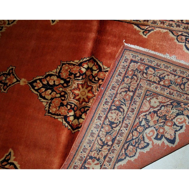 Hand-weaved antique Sarouk rug from the beginning of 20th century. The rug is in original good condition, made in...