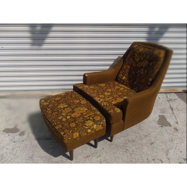 This chair is made In the style of Adrian Pearsall. It has a mid century fabric that has a Larsson fabric look, but needs...