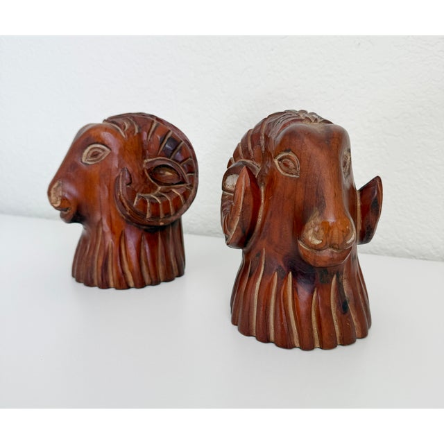 A pair of carved wood ram's head or sheep's head sculptural bookends produced by Sarreid Spain in the 1970s. This pair is...