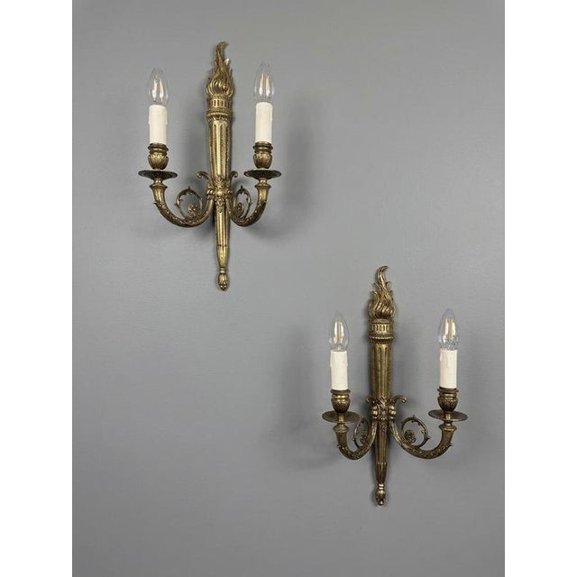 Transform your home with this exceptional pair of early 20th-century French wall sconces. Crafted from bronze, these...