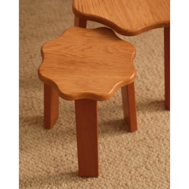 Set of nesting wooden tables, each featuring a flower-shaped top resting on a tripod base. Dimensions H 36/33/30 x D53/37/23