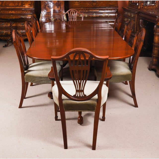 This is a fabulous Vintage dining set comprising a double pedestal dining table with a set of eight Shield Back Dining...
