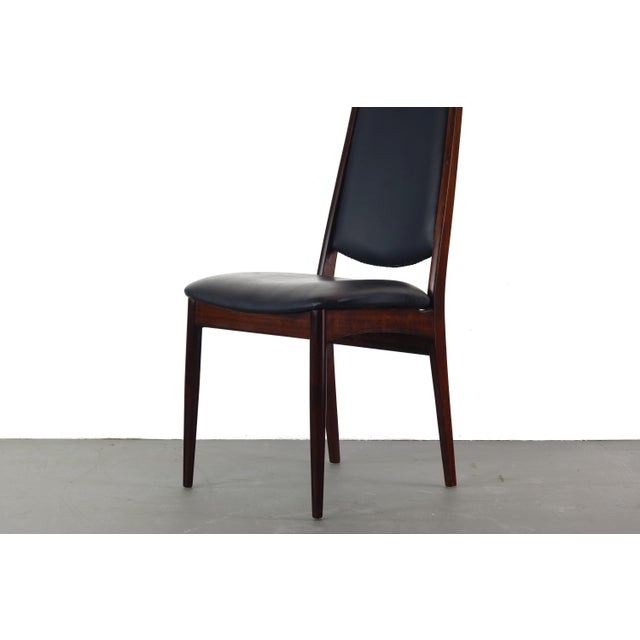 Tall, comfortable, and sturdy desk / side chair in original black vinyl and solid wood fram made of Afromasia (Danish...
