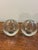 A striking pair of vintage 1960s Swedish hand-blown glass bud vases. Each features a compact spherical form in thick clear...