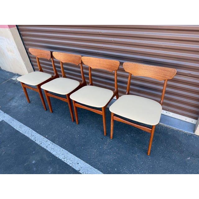Gorgeous set of 4 Danish Modern teak dining chairs by Schionning and Elgaard for Randers of Denmark. They are in excellent...