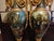 A masterfully crafted pair of inlaid green Italian marble urns, each exquisitely designed and richly detailed. The vases...