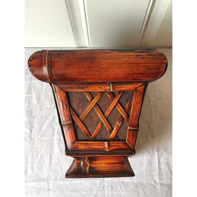 This petite bamboo and wood planter with crosshatch pattern on 4 sides would be a striking addition to any room. Perfect...