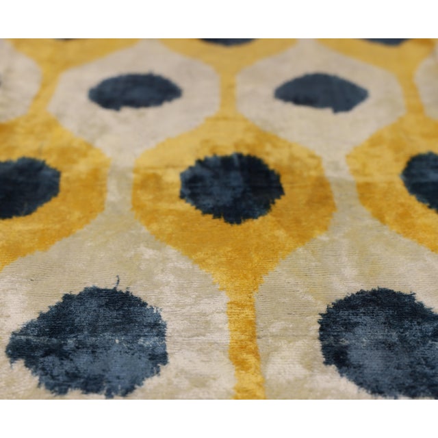 "Bright, refined, and effortlessly striking, this handmade Ikat lumbar pillow introduces a sophisticated burst of color...