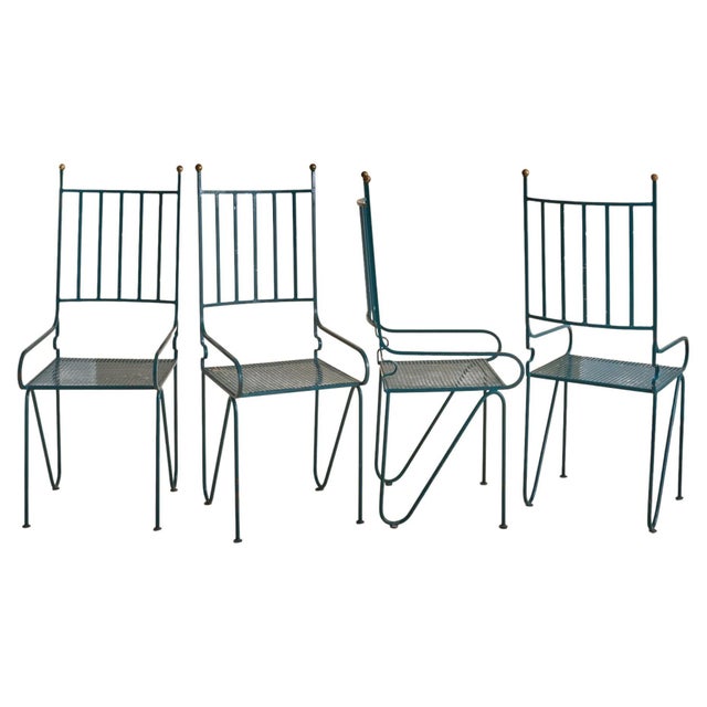 A green iron armchair, crafted in France during the 1960s. The slender iron frame retains its original green-painted...