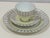 This 3-piece set by Rosenthal Germany includes a tea cup, saucer, and small plate, all featuring a wide pale yellow band...