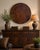 A striking oversized decorative wall charger crafted in India, featuring a richly mottled copper, bronze, and deep brown...