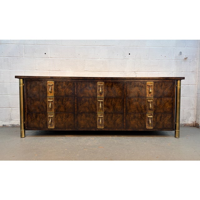 Striking and highly collectible lowboy dresser designed by Bernhard Rohne for Mastercraft Furniture during the iconic Mid-...