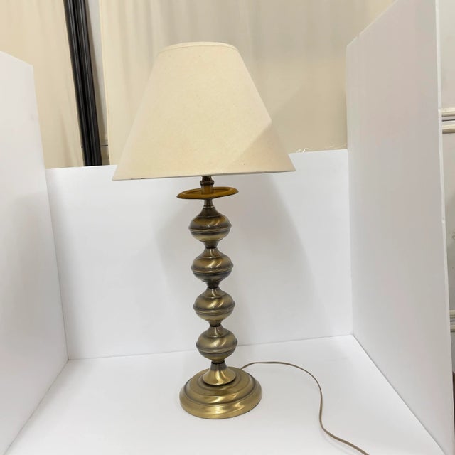 Possibly by Stiffel but, it’s unmarked. Lamp is in great shape. I didn’t notice any dents and no discoloration. It’s in...