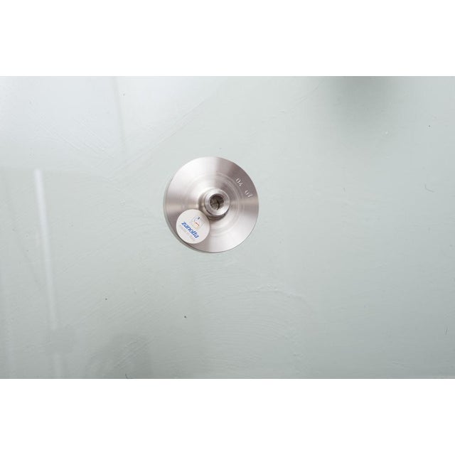 Brentano table designed by Emaf Progetti for Zanotta (1982) Glass top with bevelled edges, thickness 15 mm. Five legs in...