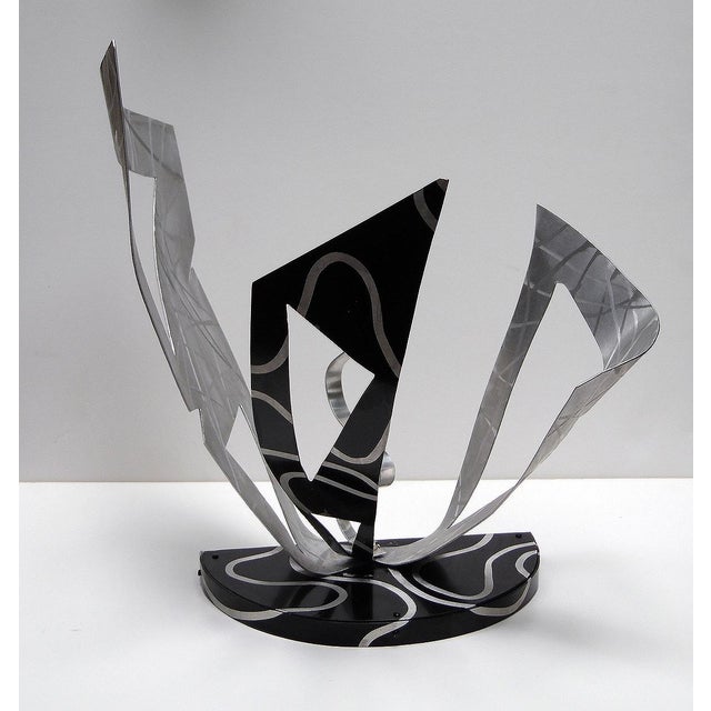 Auke de VriesBergum The Netherlands 1937- Aluminum and paint. 14 x 7 x 15.5 in. Signed, dated and titled. Auke de Vries is...