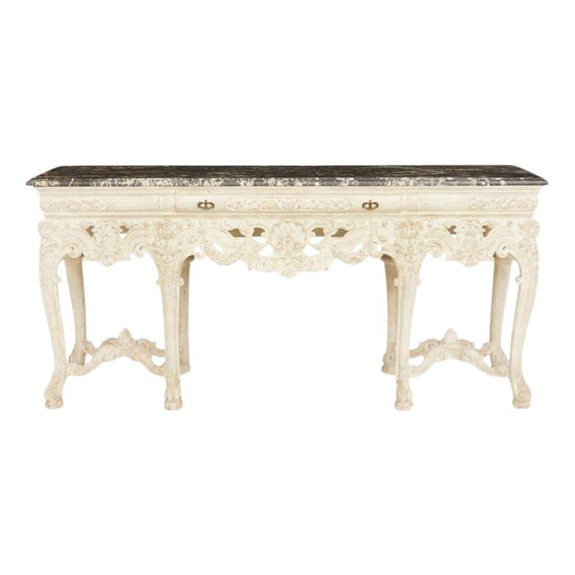 20th-century console table combines classic design elements with refined craftsmanship. The rectangular marble top...