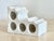 A solid, carved marble bottle display. This über heavy, block of marble with four carved cylindrical openings to display...