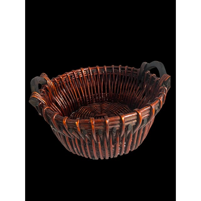 Large antique wicker basket. Very decorative piece with a beautiful color, and nicely detailed handmade work on the...