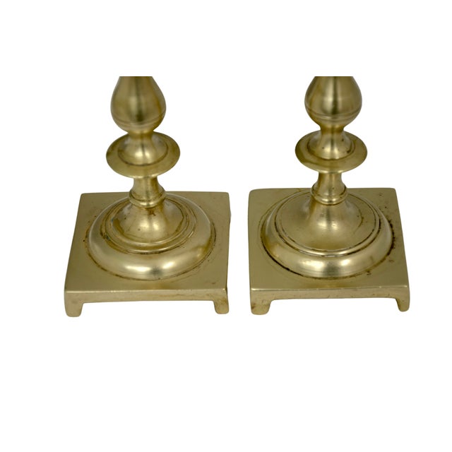 Pair of 1970's vintage seven inch turned solid brass candle holders on square bases. This pair has been polished but will...