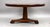 A good quality Victorian mahogany coffee table, featuring a circular top with a moulded edge, raised on a substantial...