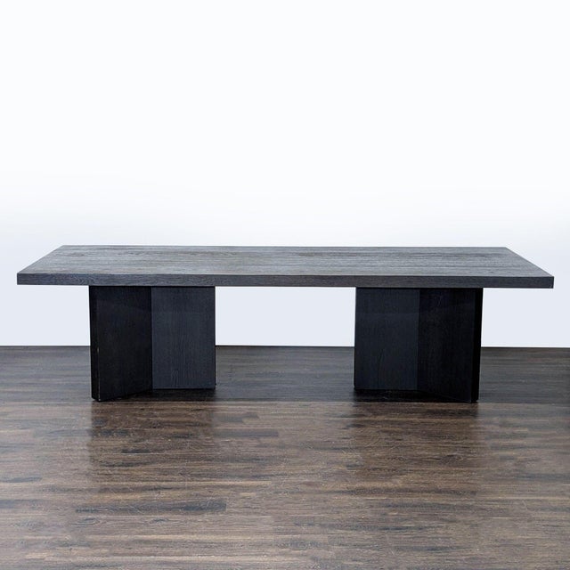 This Restoration Hardware dining set includes a large, modern rectangular table and 10 comfortable high-back chairs in a...