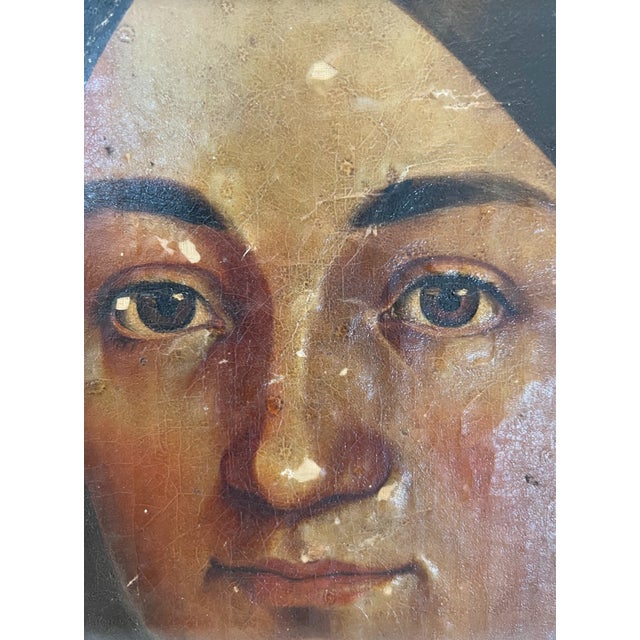 Beautiful antique original oil portrait. The painting has been mounted on board. It definitely will need to be restored.