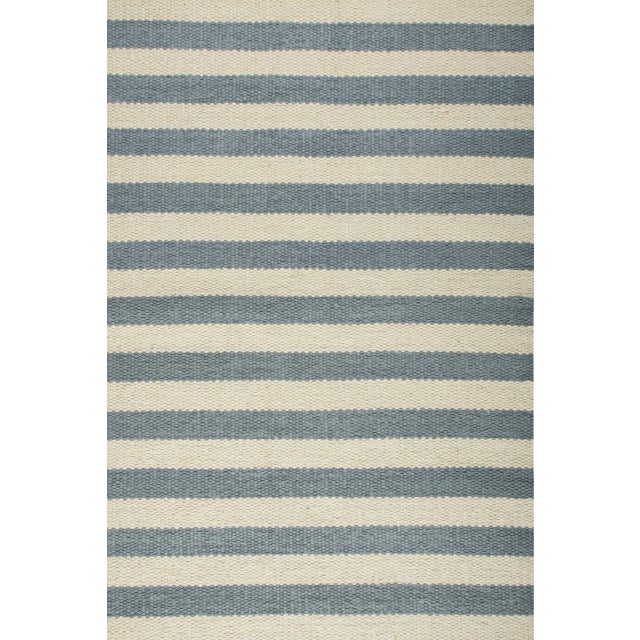 A refined 2x3 rug designed for versatile placement in intimate spaces. Ideal for entries, kitchens, baths, bedsides, and...